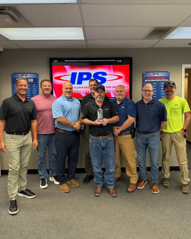 IPS employees celebrate LenelS2 VAR of the Year achievement at Integrated Protection Services.